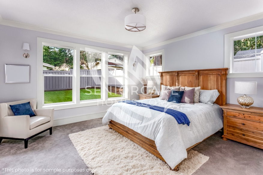 A beautiful master bedroom in a modern residential care home